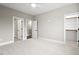 Bedroom with carpet, ceiling fan and access to closets and bathroom at 406 Terry Rd, Hillsborough, NC 27278