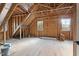 Unfinished bedroom with wood framing and new windows at 406 Terry Rd, Hillsborough, NC 27278