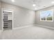 Spacious bedroom with carpeted floors and a large closet at 406 Terry Rd, Hillsborough, NC 27278