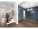 Elegant dining room boasts dark blue wainscoting and hardwood floors at 406 Terry Rd, Hillsborough, NC 27278