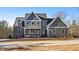 Two story home with gray siding, white accents, and a long driveway at 406 Terry Rd, Hillsborough, NC 27278