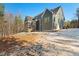 Home exterior with screened porch and snowy ground at 406 Terry Rd, Hillsborough, NC 27278