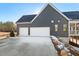 Three-car garage with snowy ground at 406 Terry Rd, Hillsborough, NC 27278