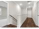 Upstairs hallway with hardwood floors and white walls at 406 Terry Rd, Hillsborough, NC 27278