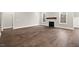 Large living room with hardwood floors and a gas fireplace at 406 Terry Rd, Hillsborough, NC 27278