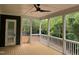 Screened porch with access door and wooded views at 406 Terry Rd, Hillsborough, NC 27278