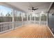 Spacious screened porch with wood flooring and wooded views at 406 Terry Rd, Hillsborough, NC 27278
