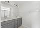 Bathroom with double vanity, gray cabinets, quartz countertops, and tile floors at 9249 Kitchin Farms Way # 432, Wake Forest, NC 27587
