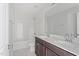 Bathroom showcasing double sinks, modern fixtures, and a tiled shower-tub combo at 9249 Kitchin Farms Way # 432, Wake Forest, NC 27587