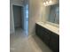 Bathroom featuring a modern vanity with double sinks and tile flooring at 9249 Kitchin Farms Way # 432, Wake Forest, NC 27587