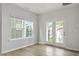 Bedroom with a large window and a glass patio door leading to the outside at 9249 Kitchin Farms Way # 432, Wake Forest, NC 27587