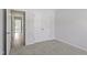 Neutral bedroom with a closet and hallway access, and plush carpeting at 9249 Kitchin Farms Way # 432, Wake Forest, NC 27587