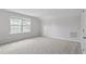 Bedroom with window letting in light and carpeted floors for comfort at 9249 Kitchin Farms Way # 432, Wake Forest, NC 27587