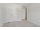 Bedroom featuring carpeting with closet and door leading to another space at 9249 Kitchin Farms Way # 432, Wake Forest, NC 27587