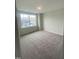 Comfortable bedroom featuring large window and plush carpeting at 9249 Kitchin Farms Way # 432, Wake Forest, NC 27587