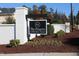 A welcoming community sign with manicured landscaping at The Preserve at Kitchin Farms at 9249 Kitchin Farms Way # 432, Wake Forest, NC 27587