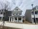 Charming two-story home with a welcoming front porch and classic architectural details at 9249 Kitchin Farms Way # 432, Wake Forest, NC 27587