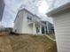 The back of this home features a covered patio and grassy backyard at 9249 Kitchin Farms Way # 432, Wake Forest, NC 27587