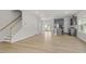 Spacious living room showcasing an open layout with hardwood floors and views of the kitchen at 9249 Kitchin Farms Way # 432, Wake Forest, NC 27587