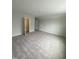 Open living room with neutral carpet, doors, and access to other spaces at 9249 Kitchin Farms Way # 432, Wake Forest, NC 27587