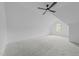 Attic room with carpet, ceiling fan, and a window at 7440 Summer Tanager Trl, Raleigh, NC 27614