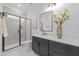 Modern bathroom with glass enclosed shower, sleek vanity, and contemporary finishes at 7440 Summer Tanager Trl, Raleigh, NC 27614