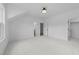 Spacious bedroom with neutral carpeting, ample space, and access to bathroom at 7440 Summer Tanager Trl, Raleigh, NC 27614