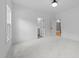 Bedroom with carpet and adjacent room through open door at 7440 Summer Tanager Trl, Raleigh, NC 27614