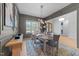The dining room has seating for six and a view into other parts of the house at 7440 Summer Tanager Trl, Raleigh, NC 27614