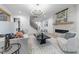 Spacious living room features fireplace, staircase, modern chandelier, and ample natural light at 7440 Summer Tanager Trl, Raleigh, NC 27614