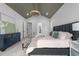 Beautifully designed main bedroom with tray ceiling, neutral colors, and ample natural light at 7440 Summer Tanager Trl, Raleigh, NC 27614