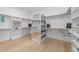 Spacious walk-in closet with built-in shelving, and ample storage space at 7440 Summer Tanager Trl, Raleigh, NC 27614