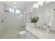 Modern bathroom with walk-in shower and stylish vanity at 7645 Falls Creek Ln, Raleigh, NC 27614