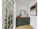 Stylish entryway with green cabinets and wood flooring at 7645 Falls Creek Ln, Raleigh, NC 27614