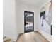 Bright and airy foyer with hardwood floors and a large statement piece of art at 7645 Falls Creek Ln, Raleigh, NC 27614