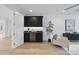 Modern wet bar with dark cabinetry and wine cooler at 7645 Falls Creek Ln, Raleigh, NC 27614