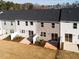 An aerial view of the back exterior of the townhomes shows patios with privacy fences at 187 Pinkie Ln, Garner, NC 27529