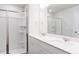 Modern bathroom with double sink vanity, walk-in shower, and glass doors at 187 Pinkie Ln, Garner, NC 27529