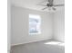 Bright bedroom with neutral carpet, ceiling fan, and a window offering an outdoor view at 187 Pinkie Ln, Garner, NC 27529