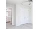 Neutral bedroom with a ceiling fan, closet and partial view of an ensuite bathroom at 187 Pinkie Ln, Garner, NC 27529
