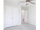 Bedroom with carpeting, closet, and a ceiling fan; ensuite bathroom in the background at 187 Pinkie Ln, Garner, NC 27529