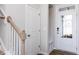 Bright entryway features a glass front door, coat rack, and wood-look flooring at 187 Pinkie Ln, Garner, NC 27529