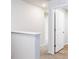 Upstairs hallway with carpet and an open doorway at 187 Pinkie Ln, Garner, NC 27529