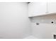 Laundry room with white cabinets, hookups, and utility sink at 187 Pinkie Ln, Garner, NC 27529