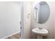Neutral powder room features a round mirror and pedestal sink at 187 Pinkie Ln, Garner, NC 27529