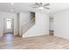 Light-filled living room featuring hardwood floors and a staircase at 191 Pinkie Ln, Garner, NC 27529