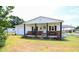 Charming single-story home featuring a welcoming front porch and well-maintained lawn at 101 Mulberry Ln, Dunn, NC 28334