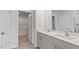 Bathroom vanity with double sinks, drawers, and a mirror above at 543 Old Battle Bridge Rd, Wendell, NC 27591