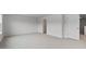 Large, carpeted bedroom with ample lighting and hallway entrances at 543 Old Battle Bridge Rd, Wendell, NC 27591