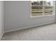 Bedroom showcasing a large window with green outdoor views and neutral walls at 543 Old Battle Bridge Rd, Wendell, NC 27591